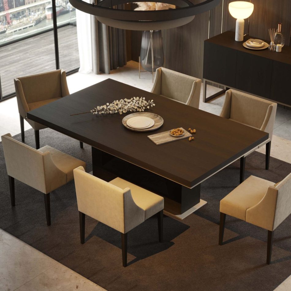 The Fortune Dining Table is styled with a delicate floral branch, ceramic plates, and metallic accents, surrounded by six upholstered chairs on a dark rug. Floor‑to‑ceiling windows reveal an urban skyline, creating a setting shaped by dining room furniture, expressive wood texture, and elevated luxury home furniture.