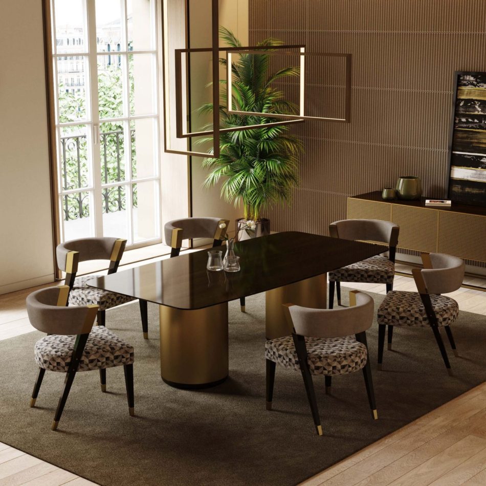 The Her Dining Table commands the room with its glossy dark top supported by two cylindrical gold bases, surrounded by patterned upholstered chairs with gold accents. A geometric chandelier and tall windows frame the scene, blending luxury dining room furniture, warm interior design inspiration, and expressive wood texture.