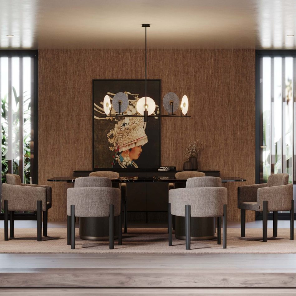 The Her Dining Table anchors the dining room with its dark, elegant surface and clean rectangular form, surrounded by gray upholstered chairs beneath a horizontal circular‑light chandelier. A textured wall and cultural artwork add depth, reflecting dining room furniture, warm living room architecture, and sophisticated luxury home furniture.