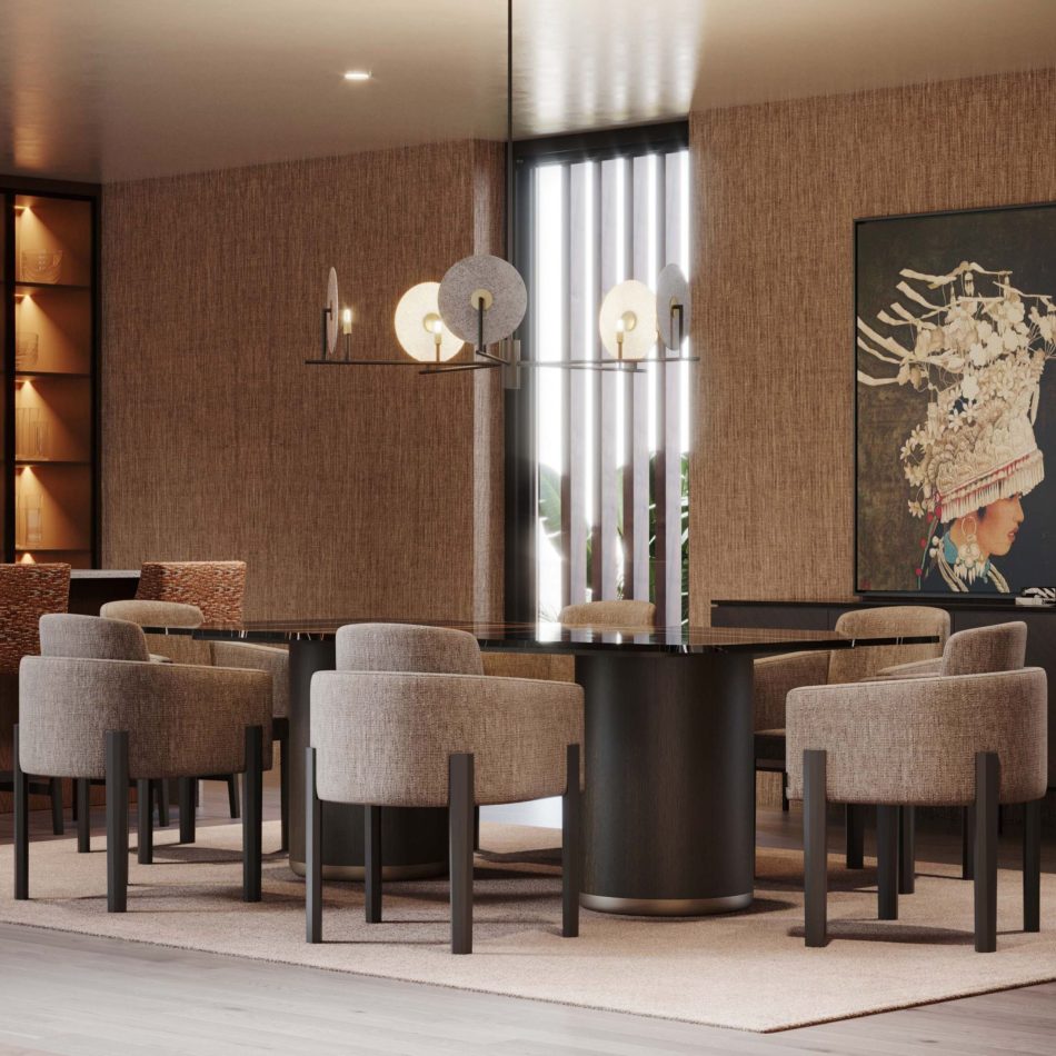 The Her Dining Table appears with a long rectangular dark‑wood top surrounded by upholstered gray chairs, illuminated by a chandelier of circular glass discs. A textured brown wall and cultural artwork frame the setting, blending luxury dining room furniture, warm design details, and contemporary interior design inspiration.