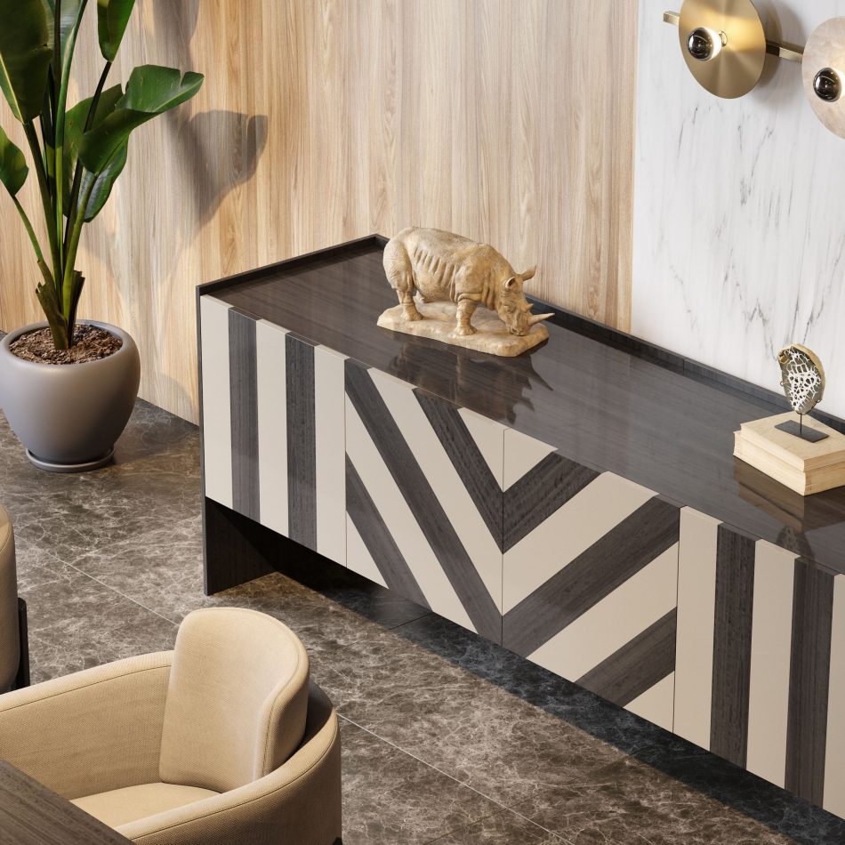 The Her sideboard showcases its patterned doors and glossy top beneath brass wall lights, framed by wood paneling and marble veining. Its sculptural decor adds character to a sophisticated environment of high end furniture, tailored living room architecture, modern luxurious furniture, and elevated living room inspiration.