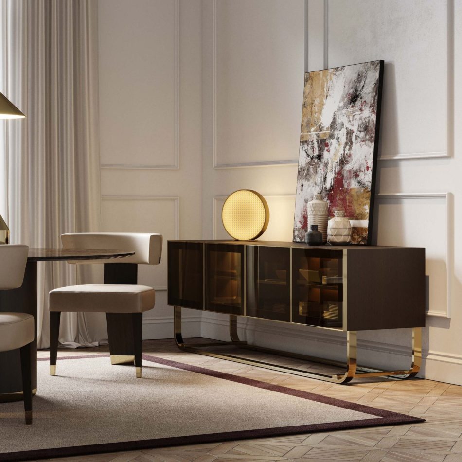 The His Sideboard anchors the dining room with its four bronze‑glass doors and dark wood structure, framed by a round mirror and warm wall lights that highlight its early‑20th‑century inspiration. Decorative vases and soft lighting elevate the scene, blending luxury dining room furniture, design details, and interior design inspiration.