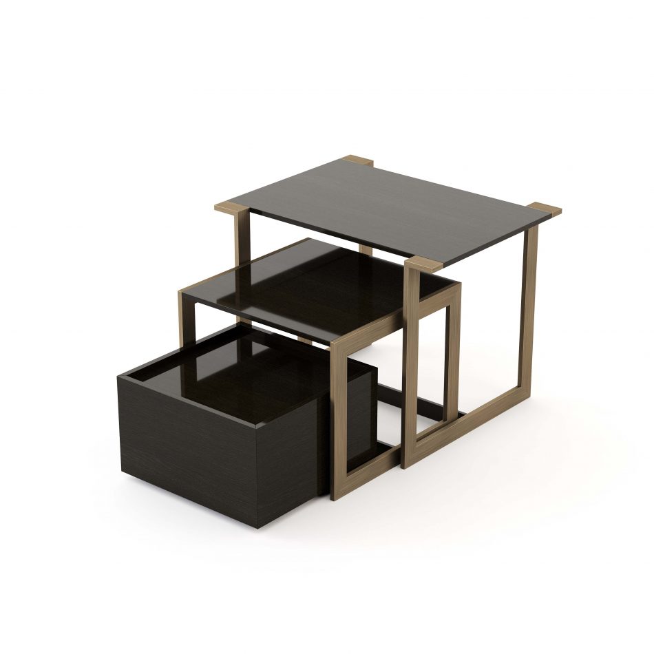 The Fortune Side Table is shown as a geometric, modular structure with a brushed bronze‑brass frame supporting two open shelves and a lower high‑gloss dark oak compartment. Its straight‑line design and contrasting materials create a refined, contemporary presence suited for a warm, elegant interior. The piece reflects sculptural modern furniture, the crafted harmony of luxury home furniture, and the versatility expected in thoughtful home furniture.