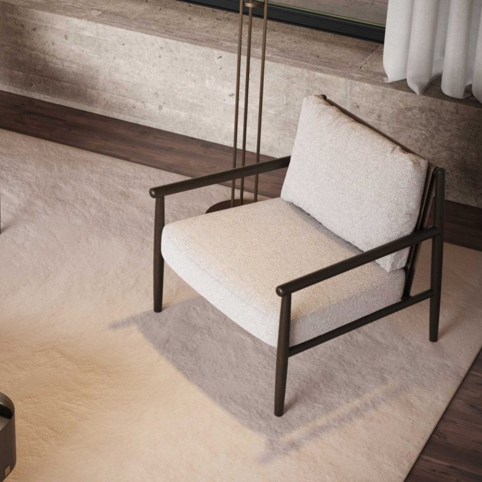 An overhead view of the Landform Armchair in neutralbouclé on a warm beige rug, its dark oak frame set beside the floor lamp's slender brass stem, highlighting the sculptural simplicity of this living room furniture piece.
