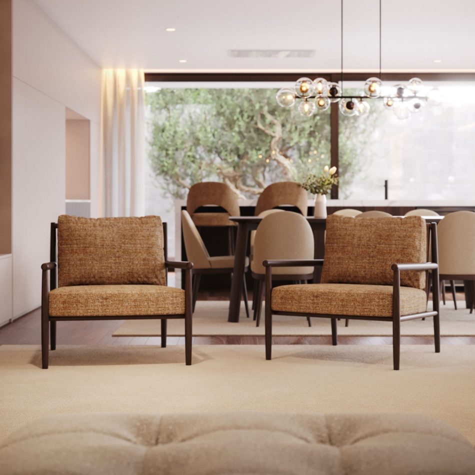 Two Landform Armchair seats in mustard tweed upholstery facing the camera, with a dark wood dining table and garden olive tree visible beyond, showcasing the warm tones of this living room furniture within an open-plan interior.