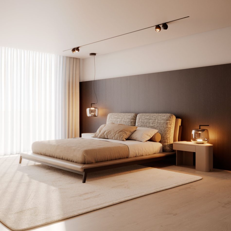 A warm, minimalist bedroom built around the Milos Bed, its low walnut frame and soft bouclé headboard set against a dark panelled wall, flanked by pendant lighting and a matching bedside table. Dressed in beige linens with warm ambient lighting, the room shows the bed working as a calm centrepiece within luxury master bedroom furniture styling, its clean lines and light tones reflecting a broader bedroom architecture approach to minimalism.