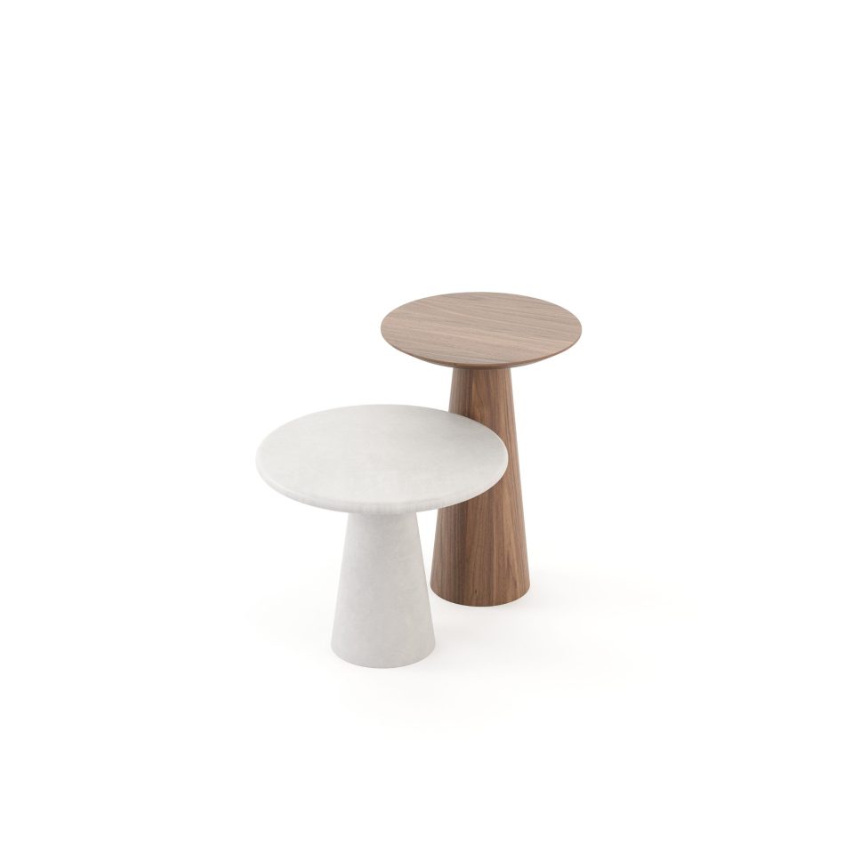 The Olivier Side Tables appear as a sculptural pairing, one shaped in warm wood and the other in soft-toned microcement, their rounded tops resting on gently tapered bases. The contrast between materials enhances the Nordic-inspired silhouette, bringing quiet rhythm and balance to the scene. Their understated geometry fits into modern furniture settings, adding a subtle layer of movement to living room furniture, while reflecting the crafted clarity associated with luxury furniture.