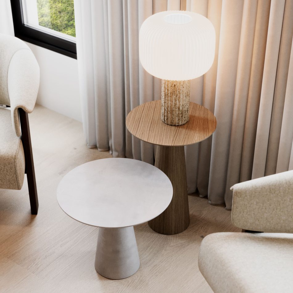 Two Olivier Side Tables crafted in natural wood and microcement anchor a minimalist corner furnished with soft upholstered seating and long draped curtains. A sculptural lamp rests on the wooden table, casting a warm glow that enhances the gentle curves and balanced proportions of the pieces. The space reflects the understated elegance of modern furniture, the inviting softness of home furniture, and the harmony found in thoughtful living room inspiration.
