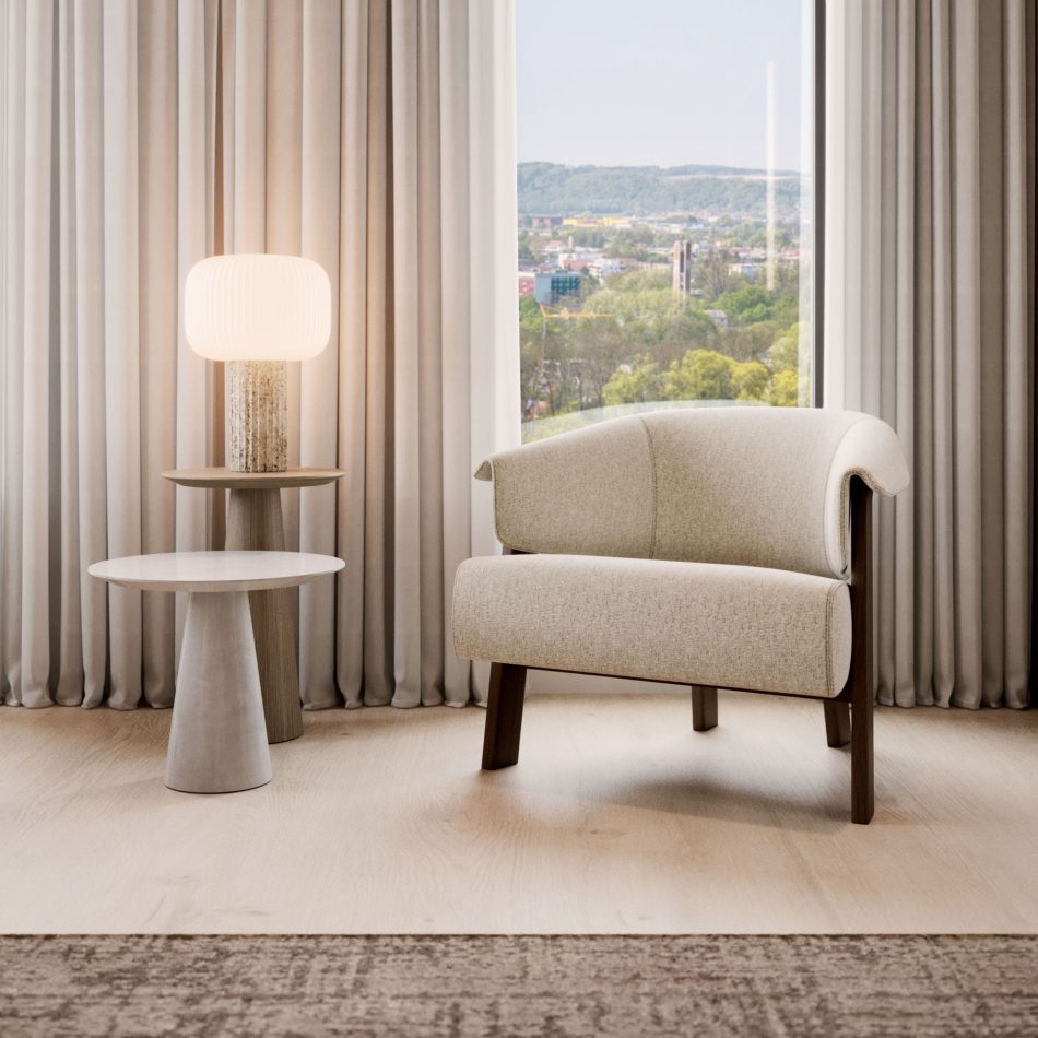 Positioned beside a large window with expansive views, the Olivier Side Tables in microcement and wood bring gentle contrast and presence to a quiet seating area. Their rounded tops and conical bases echo the room’s calm geometry, complementing the upholstered armchair and soft neutral palette. The setting reflects the clarity of contemporary furniture, the warmth of luxury home furniture, and the subtle refinement of curated design details.