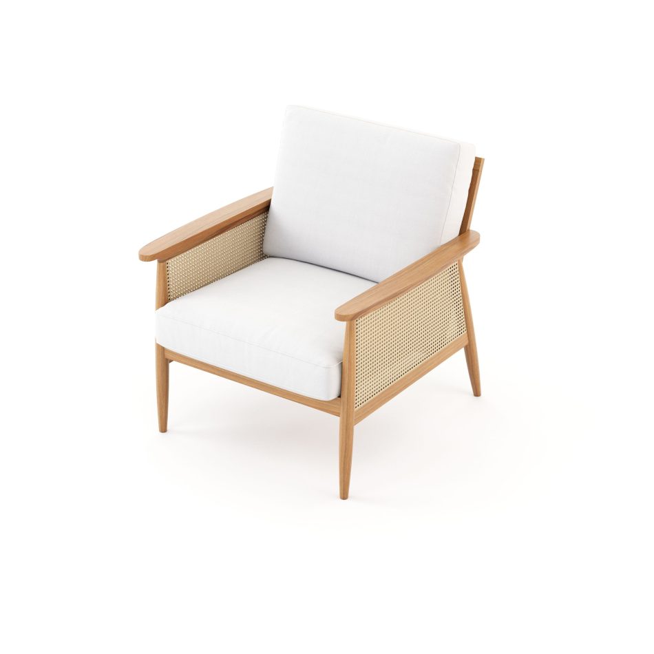 A three‑quarter view of the Natur Armchair with a smooth wooden structure, tapered legs, and woven cane detailing, complemented by soft neutral cushions. The interplay of texture and form reflects the refined craftsmanship of luxury furniture, the organic elegance of natural materials, and the understated aesthetic of minimalist design.
