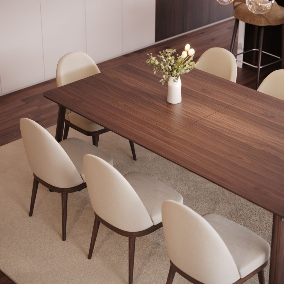 The Natur Chairs surround a rectangular wooden dining table, their soft‑touch upholstery and walnut‑tone legs adding a Nordic calm to the space. The light beige rug and clean lines of the room highlight the chairs’ gentle curves and comfortable seat, creating a welcoming atmosphere shaped by luxury dining room furniture, crafted modern furniture, and soft interior design inspiration.