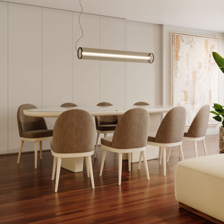 The Natur Chairs frame a large oval dining table, their smooth upholstery and light structure bringing softness to the minimalist room. A sculptural pendant light, polished wooden flooring, and abstract artwork elevate the setting, while the chairs’ Nordic lines and comfortable seat contribute to a refined atmosphere shaped by dining room furniture, subtle design details, and harmonious luxury home furniture.