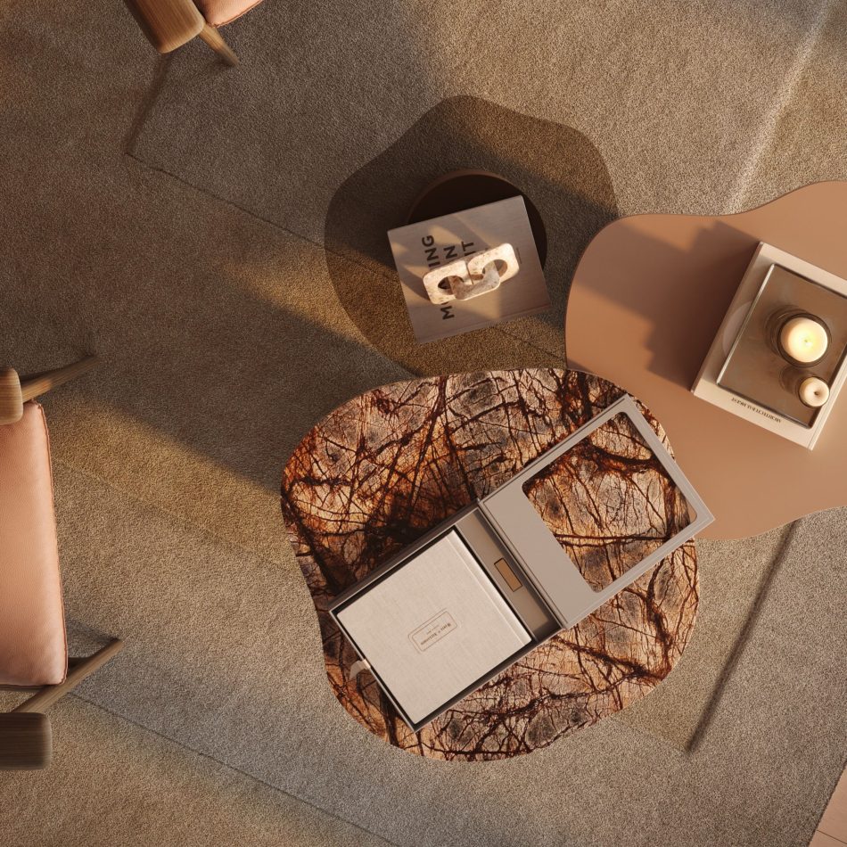 The Natur Side Tables showcase their distinctive rounded silhouettes and organic wood‑grain textures, paired with smooth neutral surfaces. Surrounded by upholstered seating and soft sunlight, the scene reflects living room furniture, expressive material texture, and warm luxury home furniture.