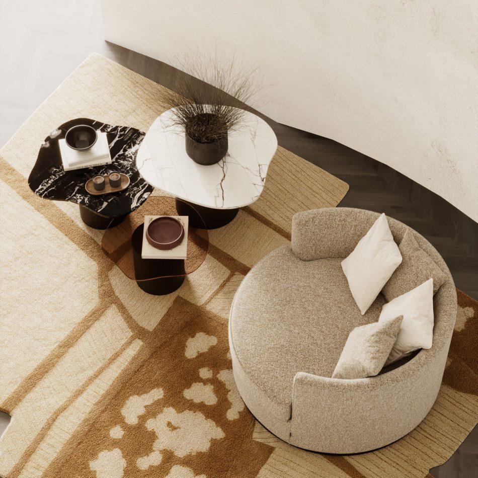 The Natur Side Tables form a sculptural trio with rounded tops in marble and glass, arranged beside a textured beige chair. Styled with books, bowls, and a delicate plant, the scene blends modern furniture, warm material contrast, and serene interior design inspiration.