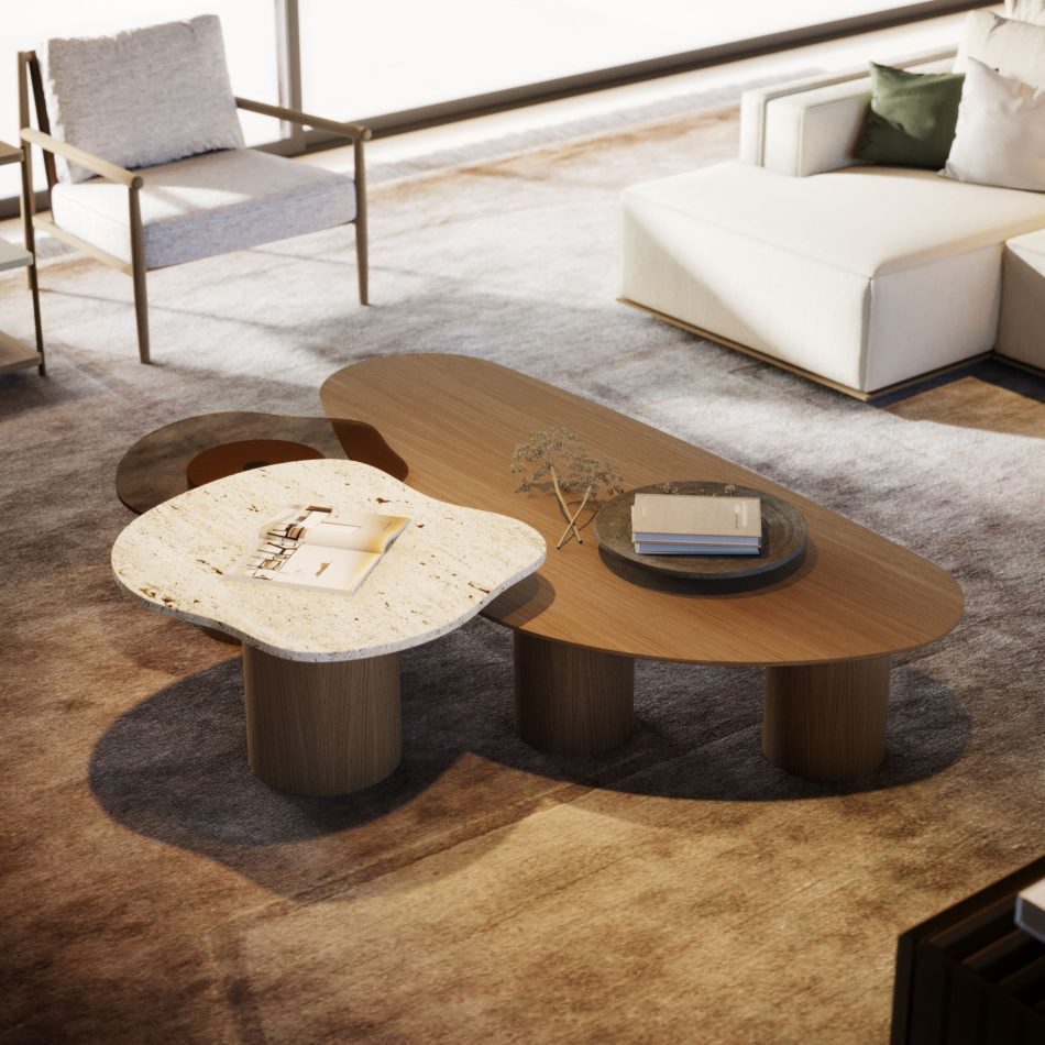 The Natur Side Tables are shown with an organic stone‑like top and an elongated wooden surface supported by cylindrical legs, styled with books and a dried botanical arrangement. The composition blends luxury coffee table design, expressive natural materials, and interior design inspiration.