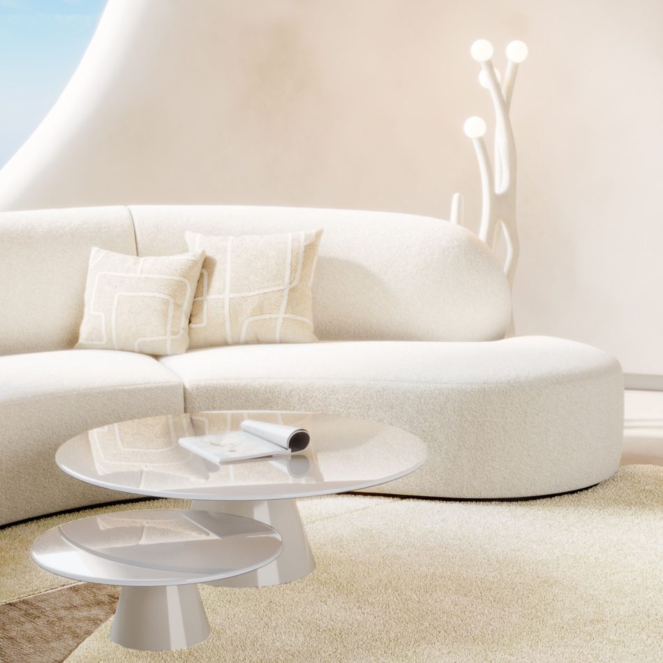 Bright, serene living room ambiance with warm neutral tones, focusing on a glossy cream Olivier luxury coffee table pair set against a plush curved sofa to create a minimalist design with luxury handmade furniture.
