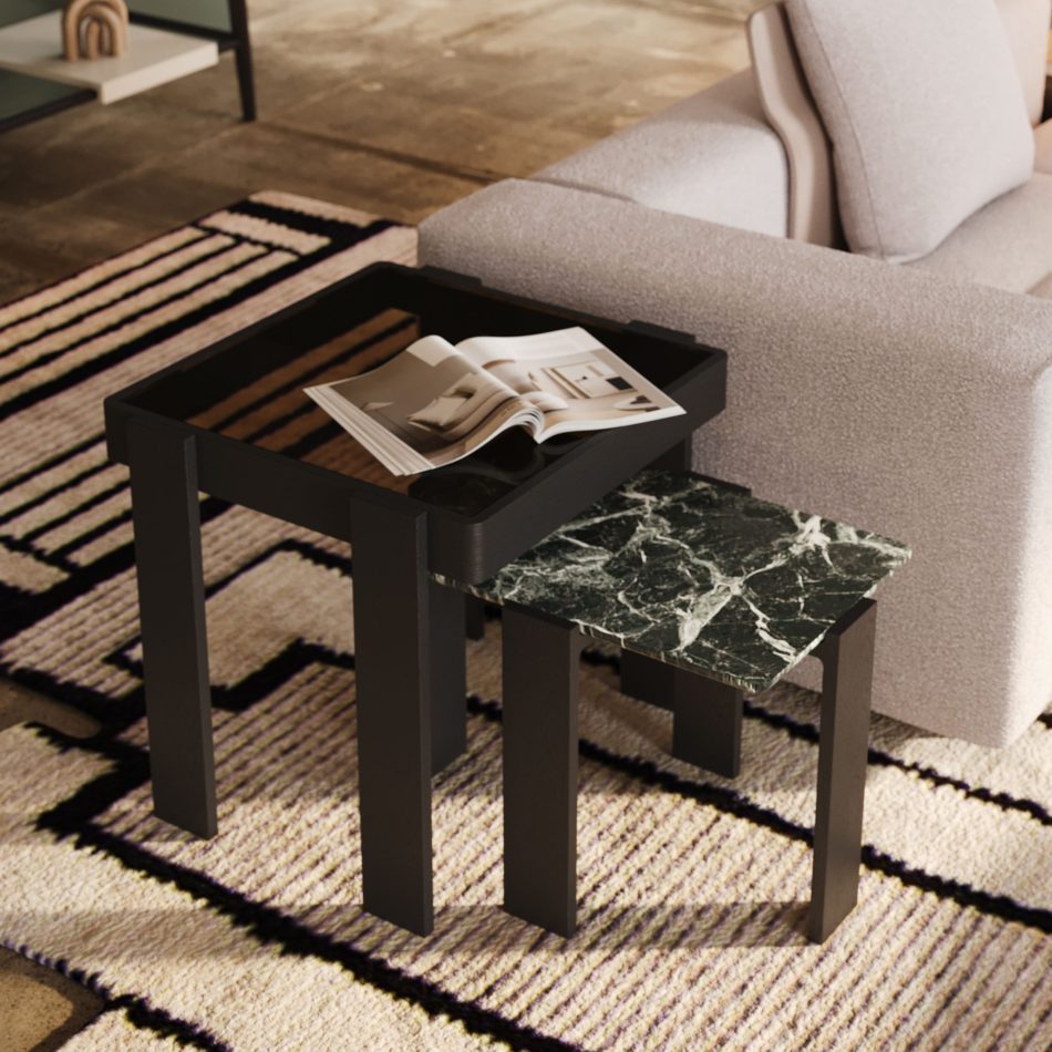 The Foz Side Tables stand as two complementary forms, one topped with dark green marble and the other with a smooth glass surface, capturing the fluidity of a river’s edge. Positioned against soft seating and natural textures, they reflect luxury home furniture, expressive wood texture, and contemporary furniture luxury design.