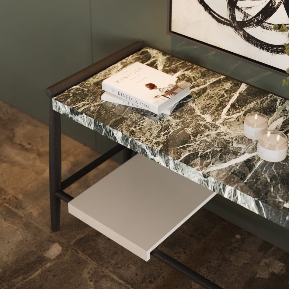 A close view highlights the Landform Console’s marble surface and wooden legs, paired with minimalist styling through books and candles. The natural stone veining and clean geometry express the console’s discreet elegance, merging modern furniture, crafted furniture luxury design, and the timeless appeal of high end furniture.