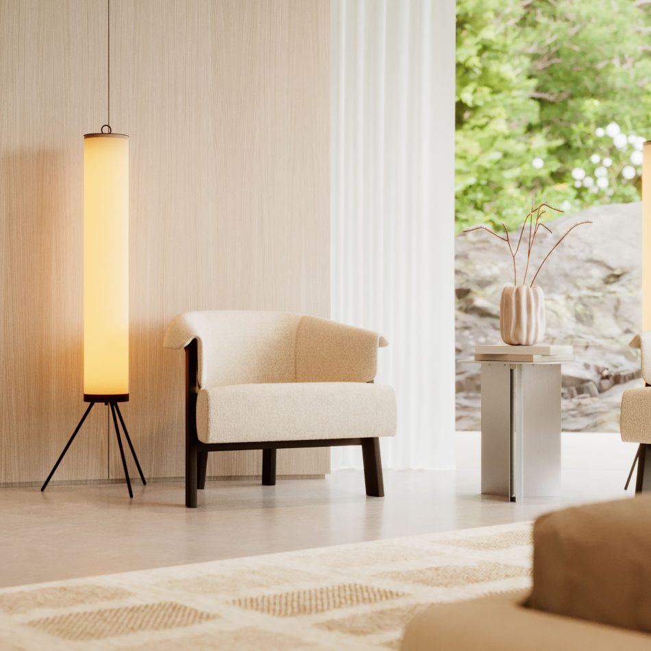 In a softly lit corner, the Steel Side Table in stainless steel brushed rests beside an upholstered armchair, its round silhouette supporting a sculptural vase with delicate branches. Sheer curtains frame the outdoor greenery, adding depth and tranquility to the scene. The setting embodies the serenity of living room furniture, the thoughtful restraint of modern furniture, and the quiet sophistication found in intentional design details.