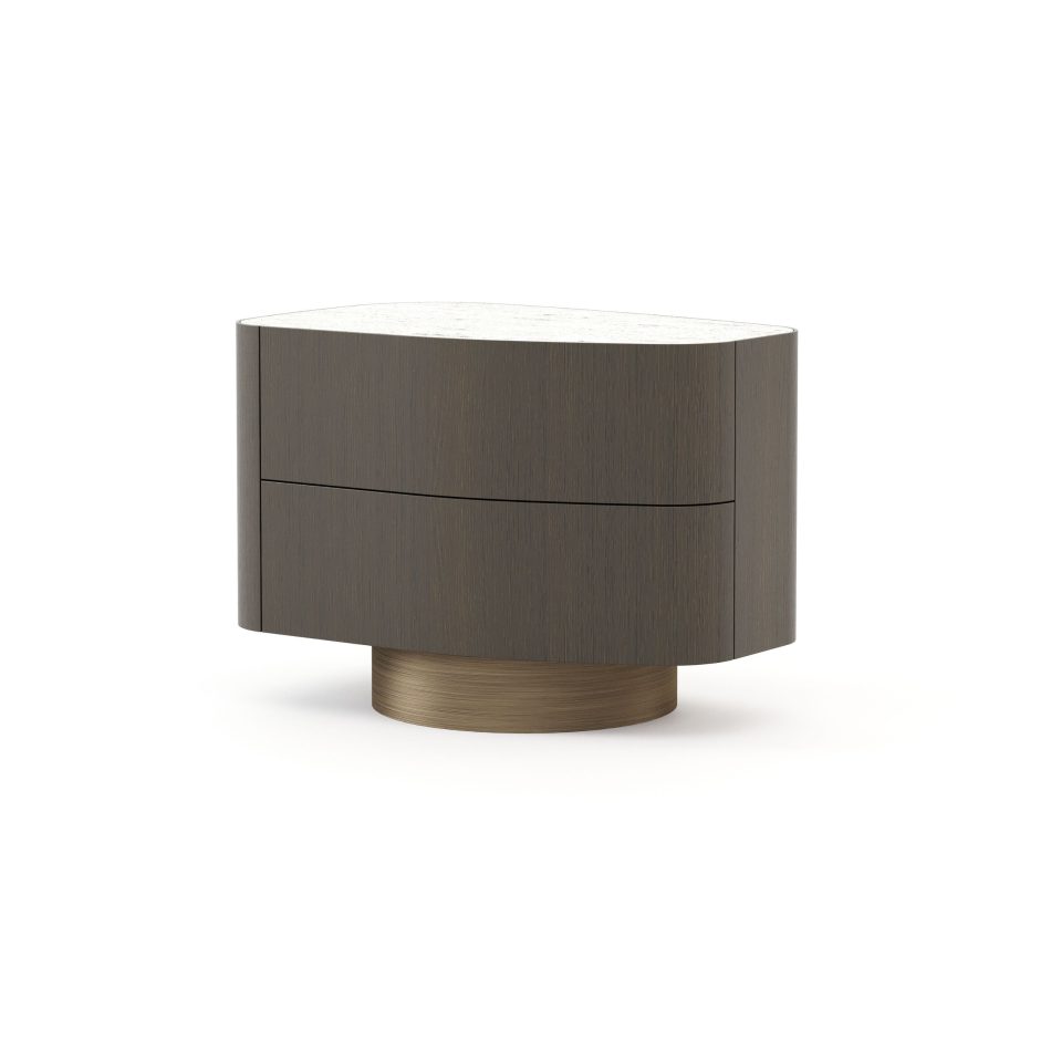 A sculptural Stone Night Table II with two drawers combines a pale marble top, smooth wooden structure, and a brushed bronze base, capturing the timeless energy of naturally shaped stones. The design introduces sophisticated bedroom furniture, subtle design details, and elevated luxury bedroom furniture.