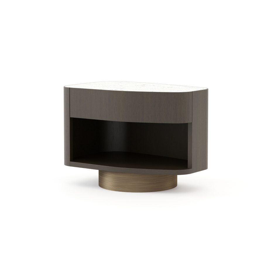 The Stone Night Table III features a smooth Travertine top resting over a curved wooden body with a drawer and open shelf, echoing the softened contours of river‑shaped stones. Its grounded silhouette blends luxury home furniture, warm design details, and serene interior design inspiration.