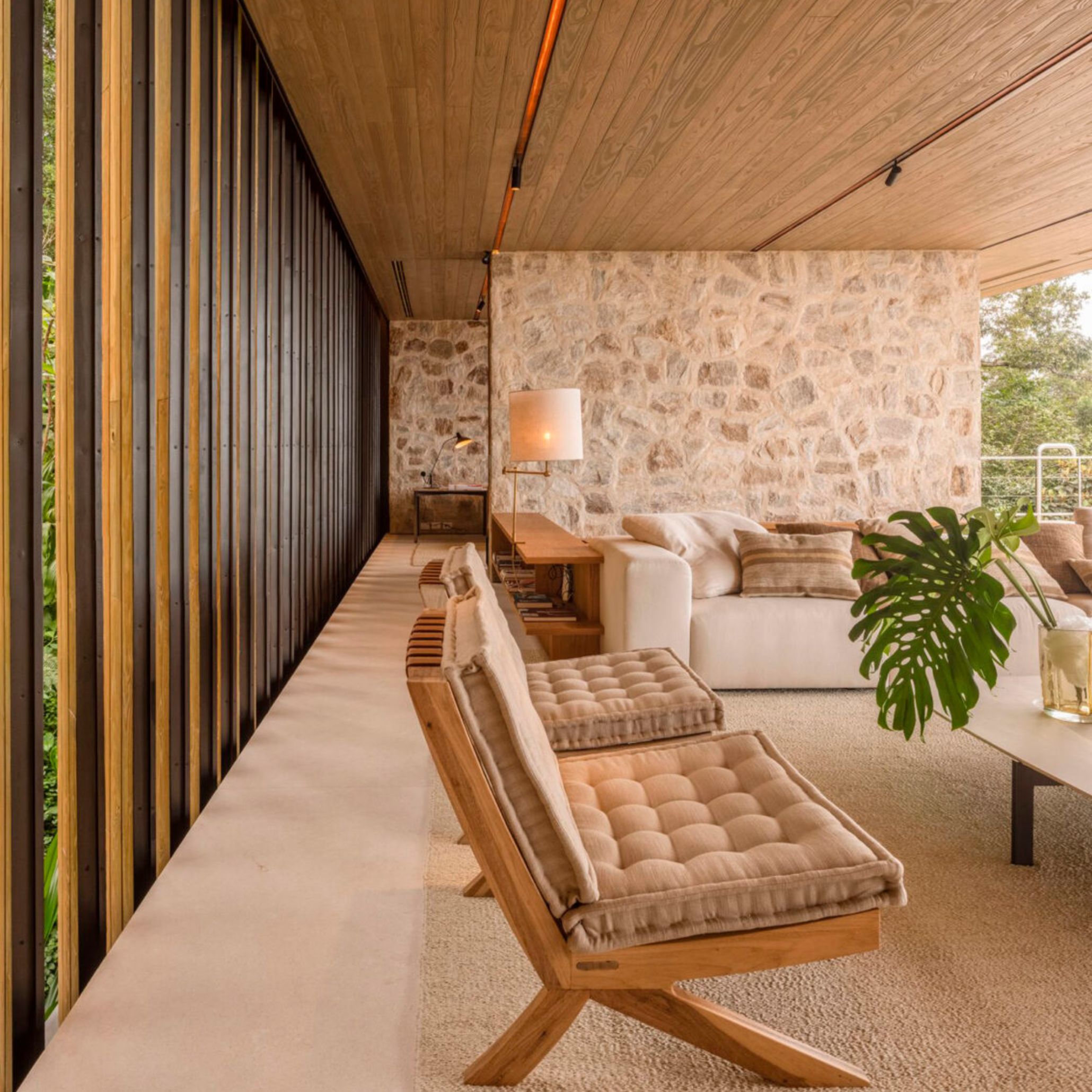 LAB House living room view, featured by earthy tones and plants.