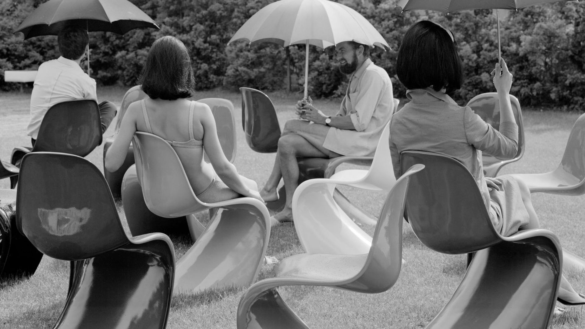 People sitting outside on the Panton Chair.