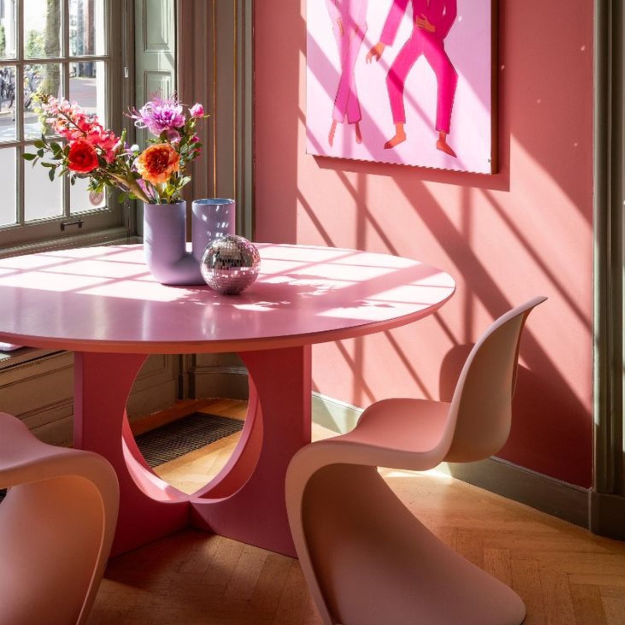 Colorful dining room with Panton chairs.