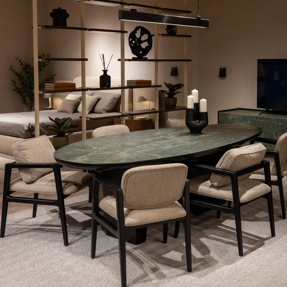 The Stone dining table by Stylish Club featuring soft, rounded edges and a sculptural base, blending natural movement with refined design in line with the fluid forms trend.