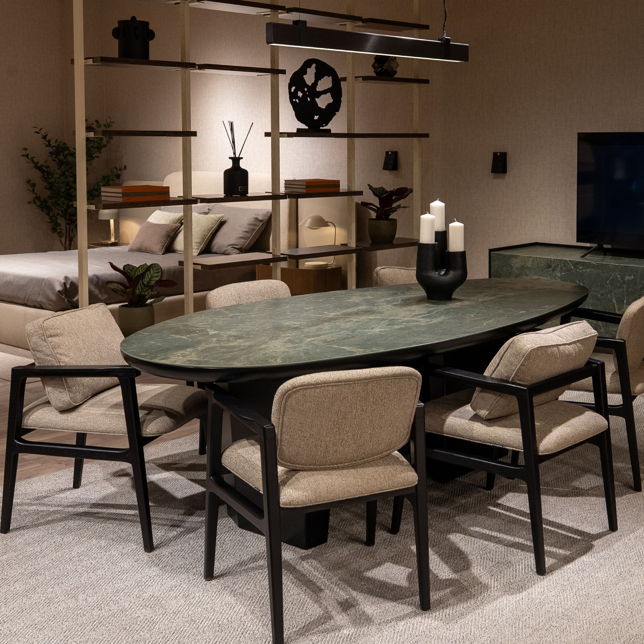 The Stone dining table by Stylish Club featuring soft, rounded edges and a sculptural base, blending natural movement with refined design in line with the fluid forms trend.
