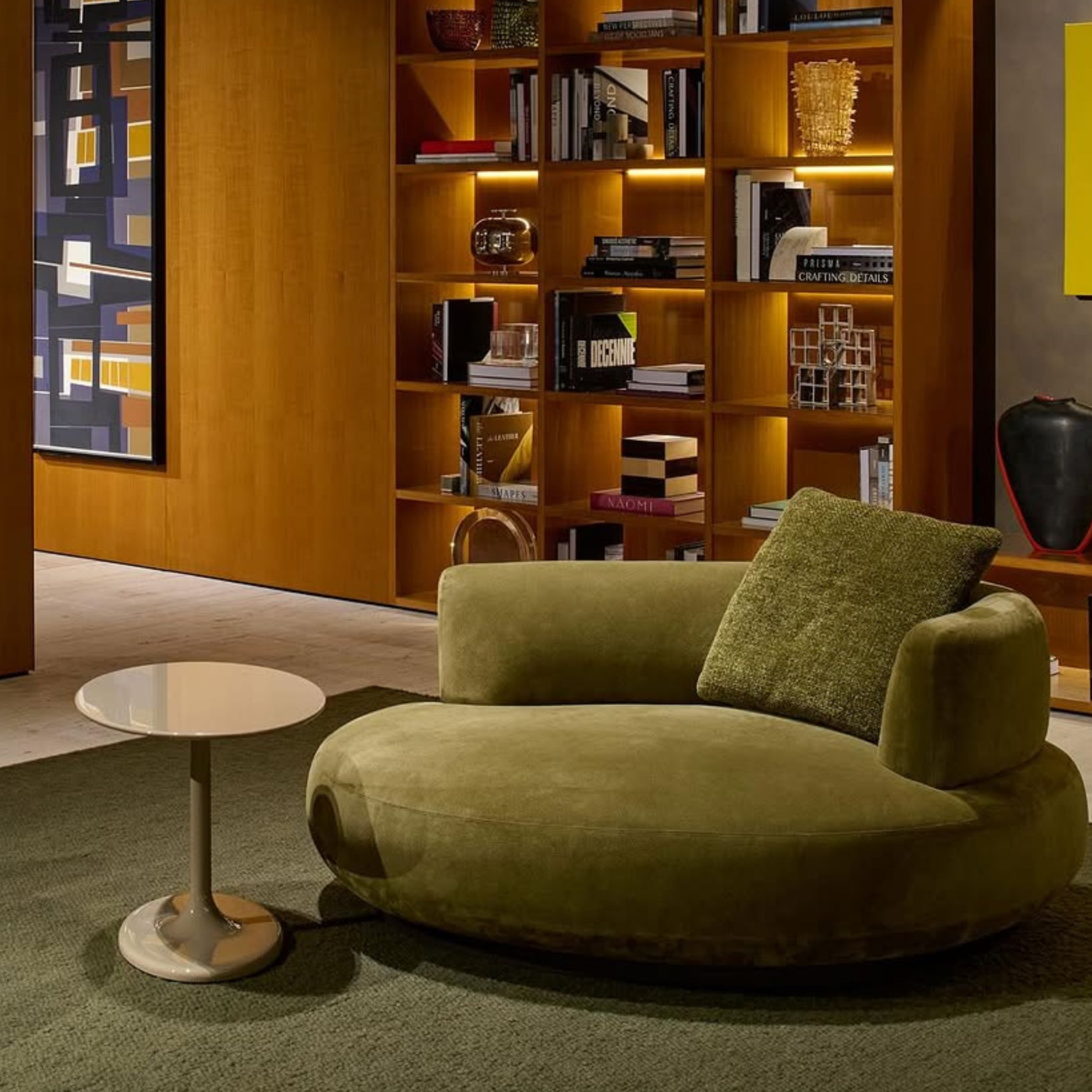 A moss green velvet armchair that highlights the earthy color palette of 2025, blending texture with nature-inspired design.