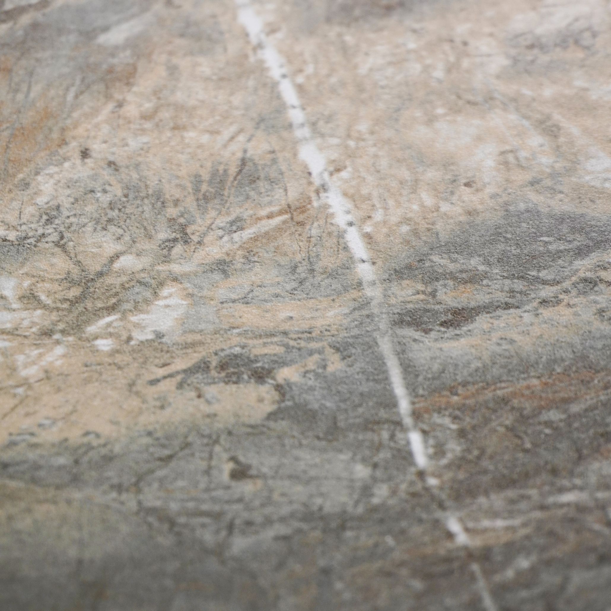 A textured stone showcasing the raw, sculptural appeal of natural materials celebrated at Salone del Mobile 2025.