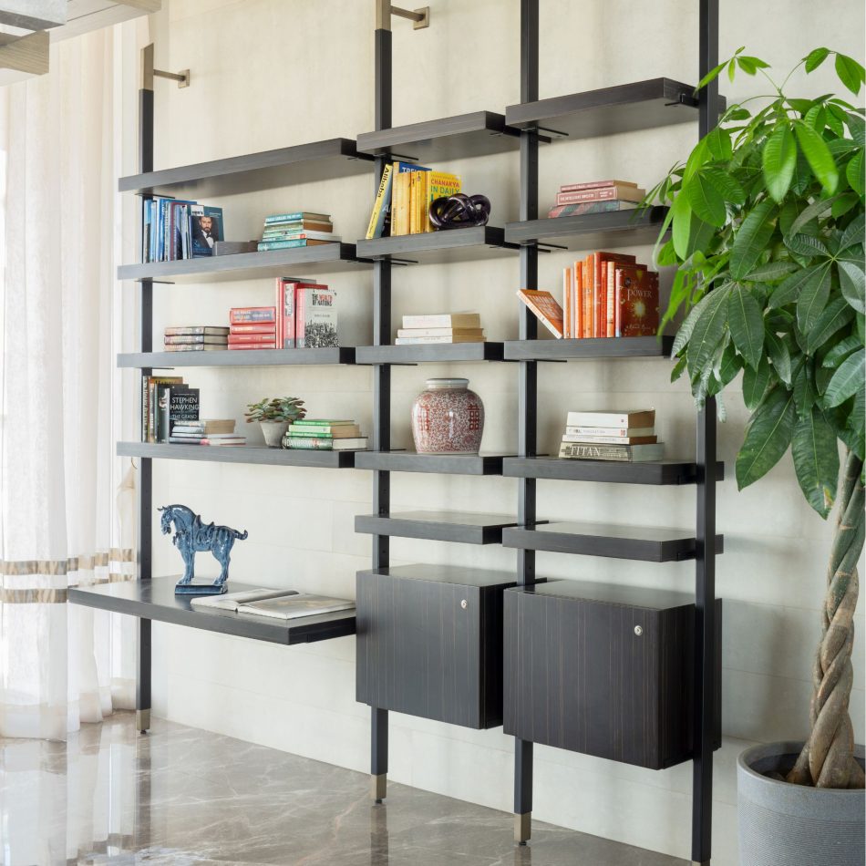 His bookcase replete with personal decorations.