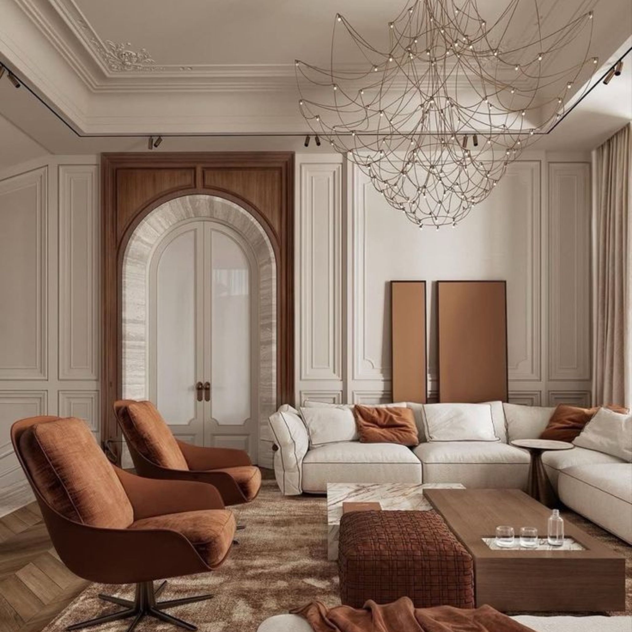 Elegant living room with a chandelier, velvet chairs, and wood-paneled details, harmonizing classic architecture with contemporary materials.