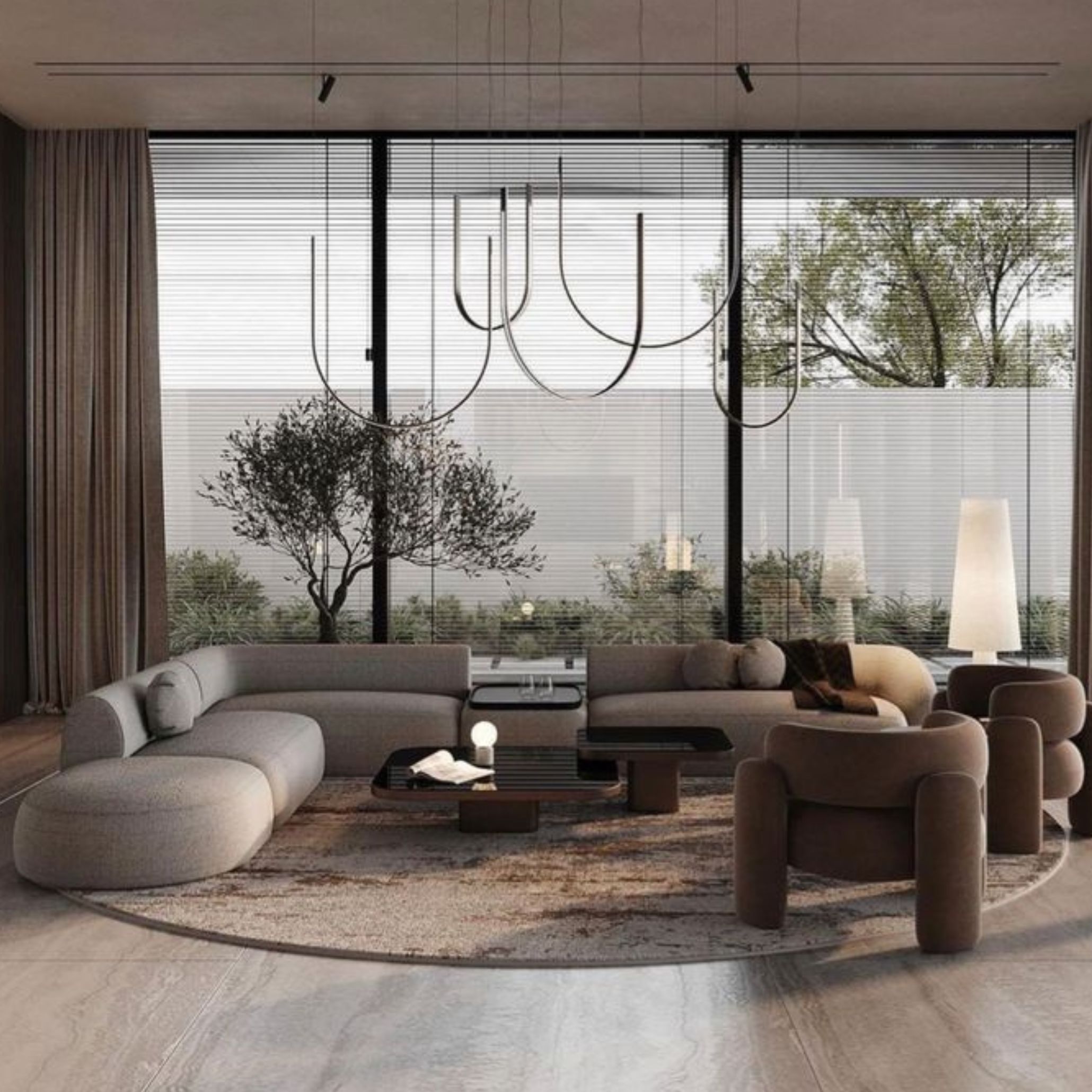 Contemporary living room with curved seating arrangement, sculptural lighting, and a neutral palette, embracing the softness of urban minimalism.