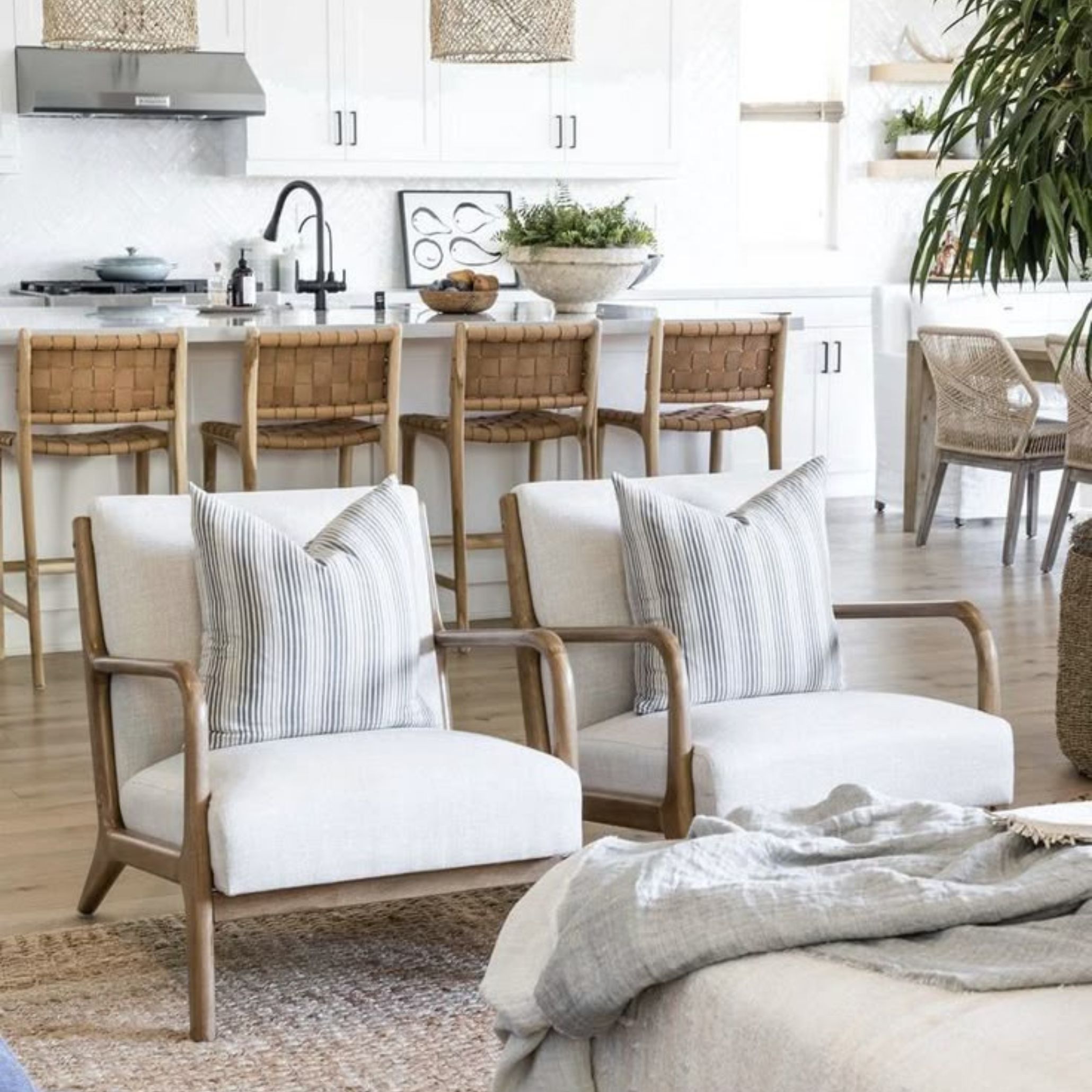 Contemporary Coastal Interior combining natural textures like wood, linen and woven chairs, with light-filled space and clean-lined furniture to create a warm and stylish coastal atmosphere.