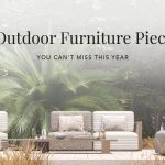 Promotional banner titled "5 Outdoor Furniture Pieces You Can’t Miss This Year," featuring a serene Hamptons-inspired outdoor setting. The image showcases the Bespoke Her Sofa by Stylish Club with modular striped and patterned cushions, paired with the Escarpa Coffee Table in Grey Oak Mate. Surrounded by lush greenery and architectural wood panels, the scene embodies elegant outdoor living.