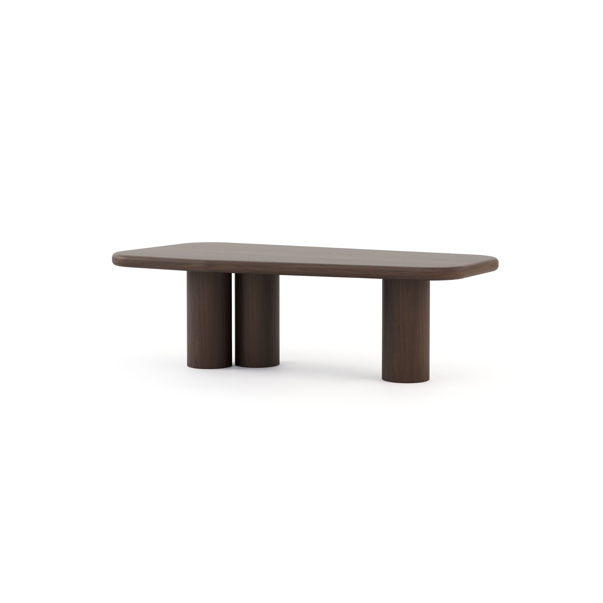 Natur Dining Table with a solid wood top and cylindrical legs in dark wood veneer, evoking the bold, grounded character of Mediterranean Interior Design. Its organic geometry and natural finish recall the farmhouse tables where meals, stories, and moments linger in warm, inviting Mediterranean homes.