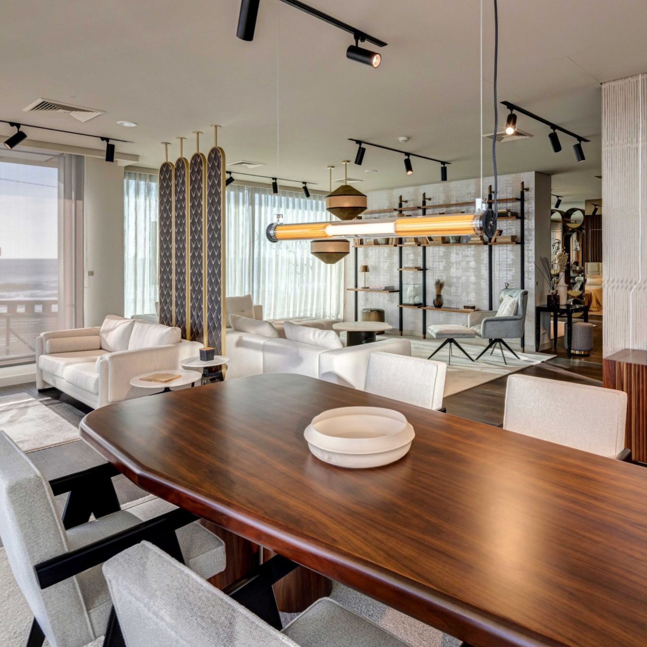 Natur Dining Table situated in a neutral dining room reflecting Mediterranean Aesthetic principles. The table’s solid wood craftsmanship harmonize with natural materials and sunlit spaces, creating a communal area that celebrates the joy of shared meals and the timeless beauty of Mediterranean Furniture.