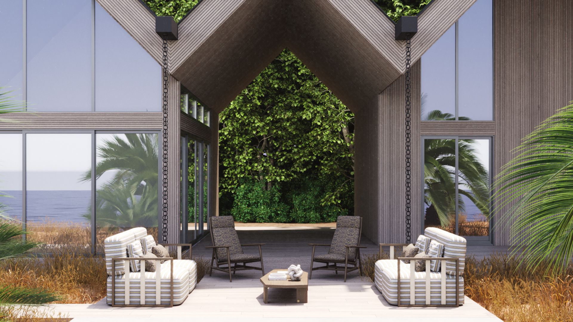 The exterior of the Hamptons Villa, designed with timeless elegance and functional comfort in mind. The bespoke setting includes the sculptural Her Sofa with dual-fabric upholstery and modular design, and Ripa Armchairs in Grey Oak Mate, all forming a cohesive and elevated outdoor living experience.