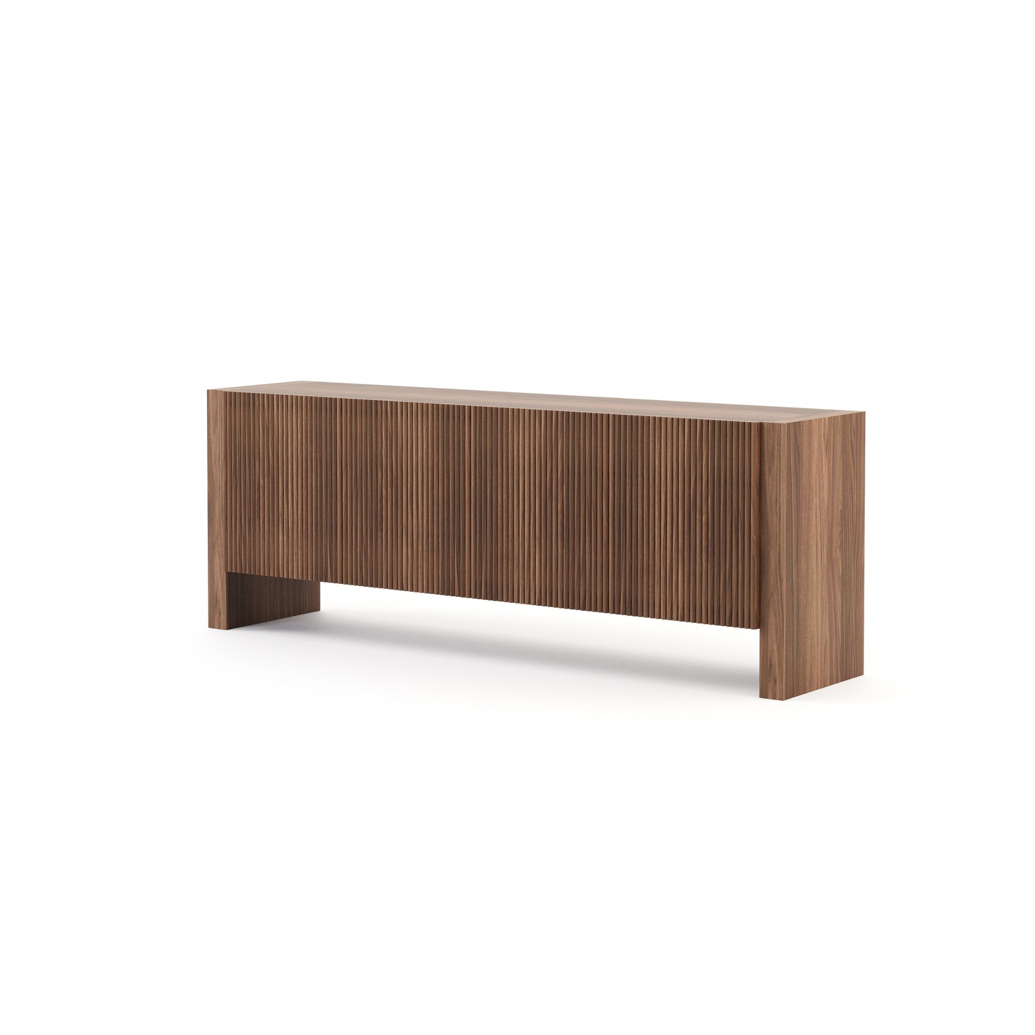 The Faro Sideboard with slatted wooden doors and a walnut matte finish stands as an elegant and functional piece. Its handcrafted feel and organic texture add quiet sophistication and continuity to an open-plan Tuscan living and dining area.