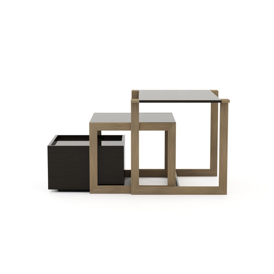 The Fortune Side Table appears as a stepped arrangement of geometric blocks, combining dark wood surfaces with light wood or metal frames for a minimalist, architectural look. Its modular design emphasizes functionality while keeping a sophisticated, contemporary attitude. The composition reflects curated home furniture, the clarity of contemporary furniture, and a subtle sense of interior design inspiration.