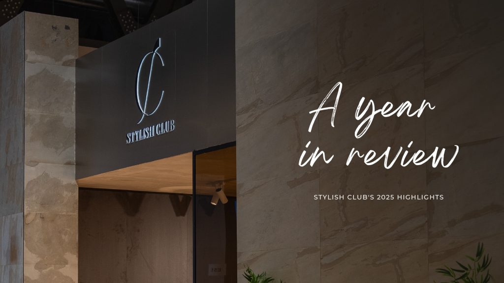 Entrance of Stylish Club with illuminated signage and branding for “A Year in Review: 2025 Highlights.” The setting reflects a year of innovation, global presence, and elegant design milestones. A visual summary of the brand’s journey through craftsmanship, creativity, and transformative projects.