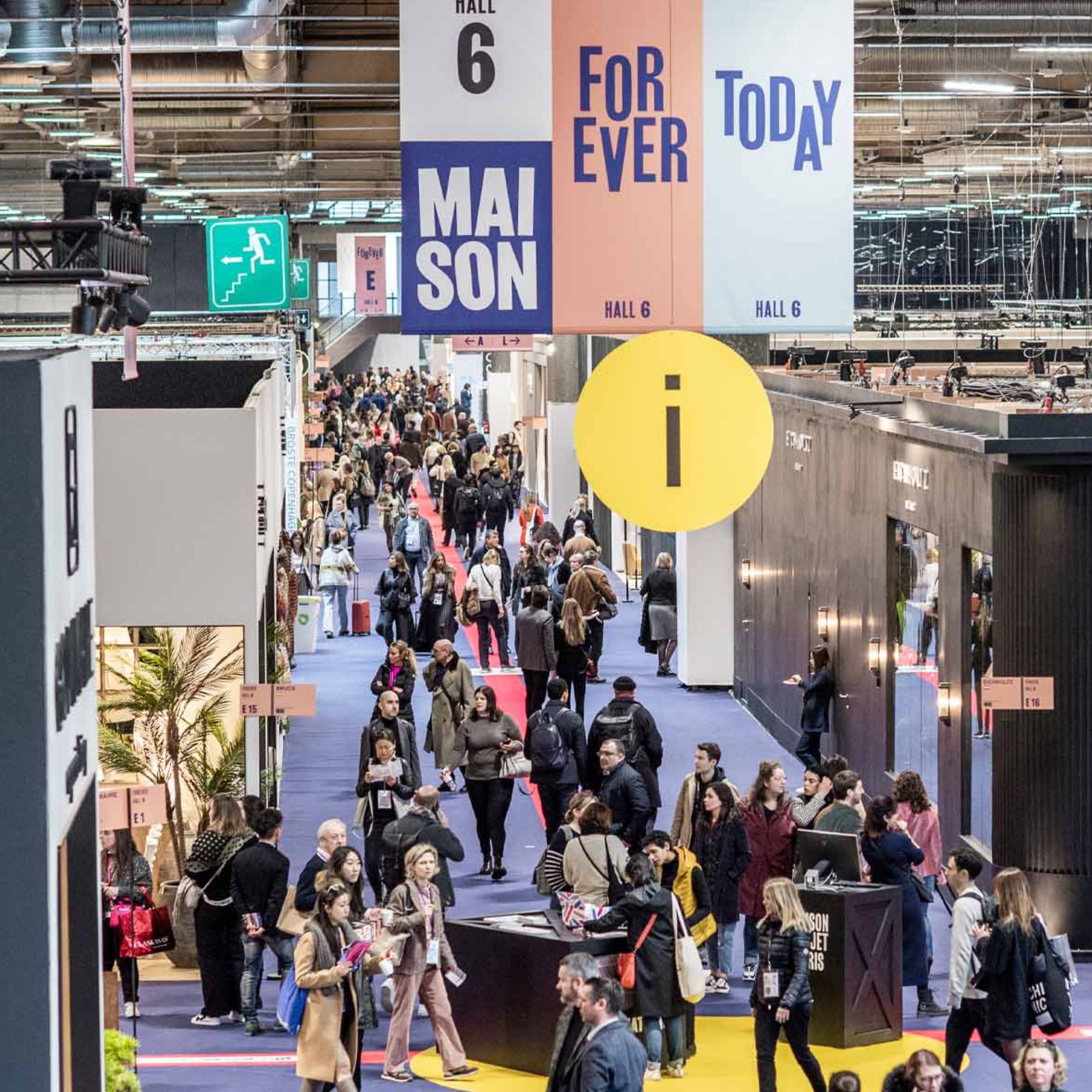 Visitors walk along an aisle at the Maison & Objet fair, exploring curated installations and innovative interior design displays.