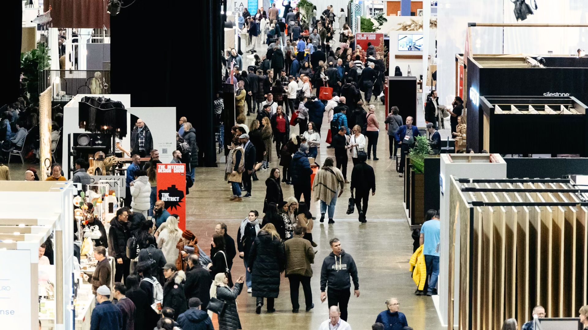 Visitors walk through IDS Toronto, exploring contemporary design exhibitions and innovative interior design showcases.