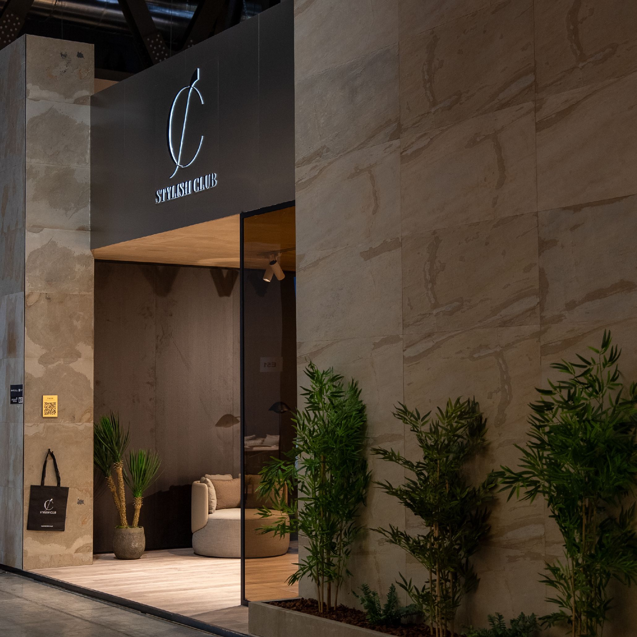 Stylish Club’s stand at Salone del Mobile 2025, featuring contemporary furniture pieces and elegant interior design elements.