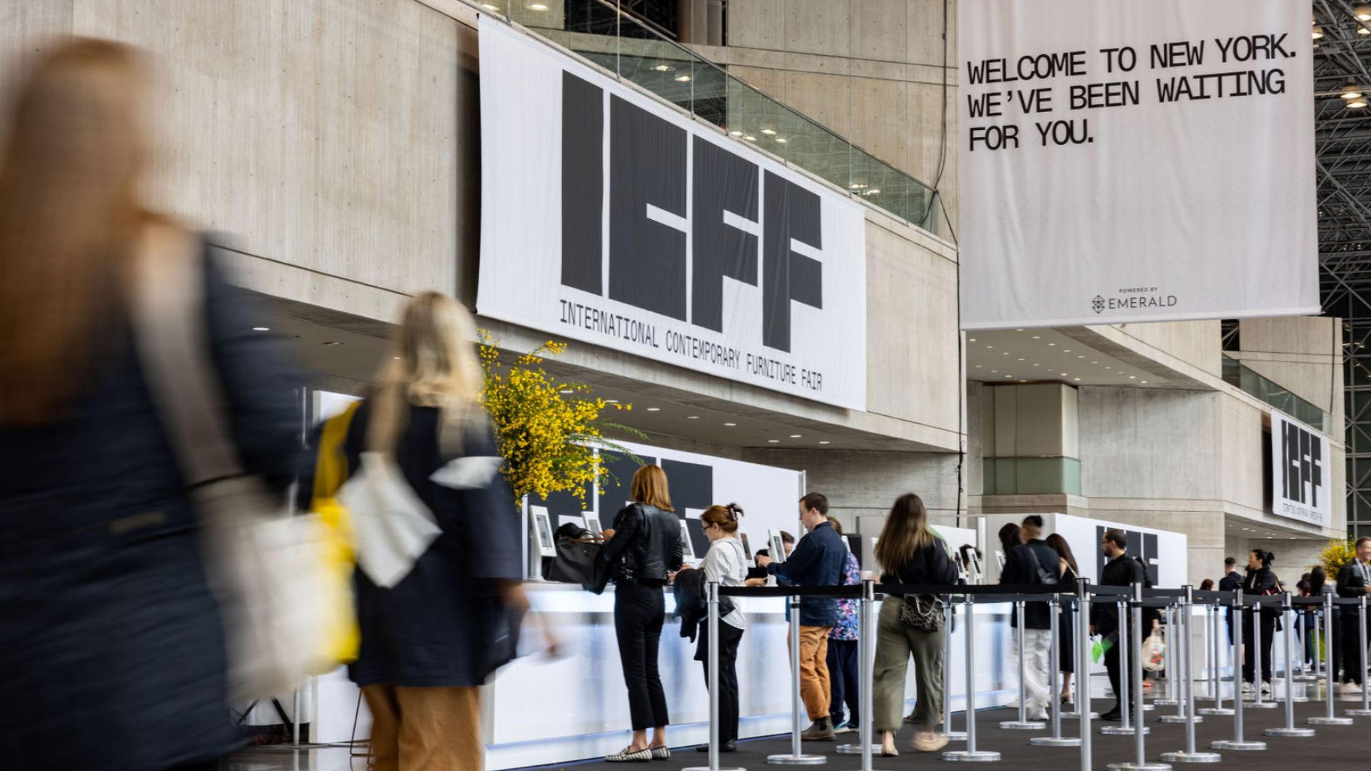 Visitors arrive at the ICFF entrance in New York, gathering for the contemporary furniture fair showcasing innovative design and high-end interiors.