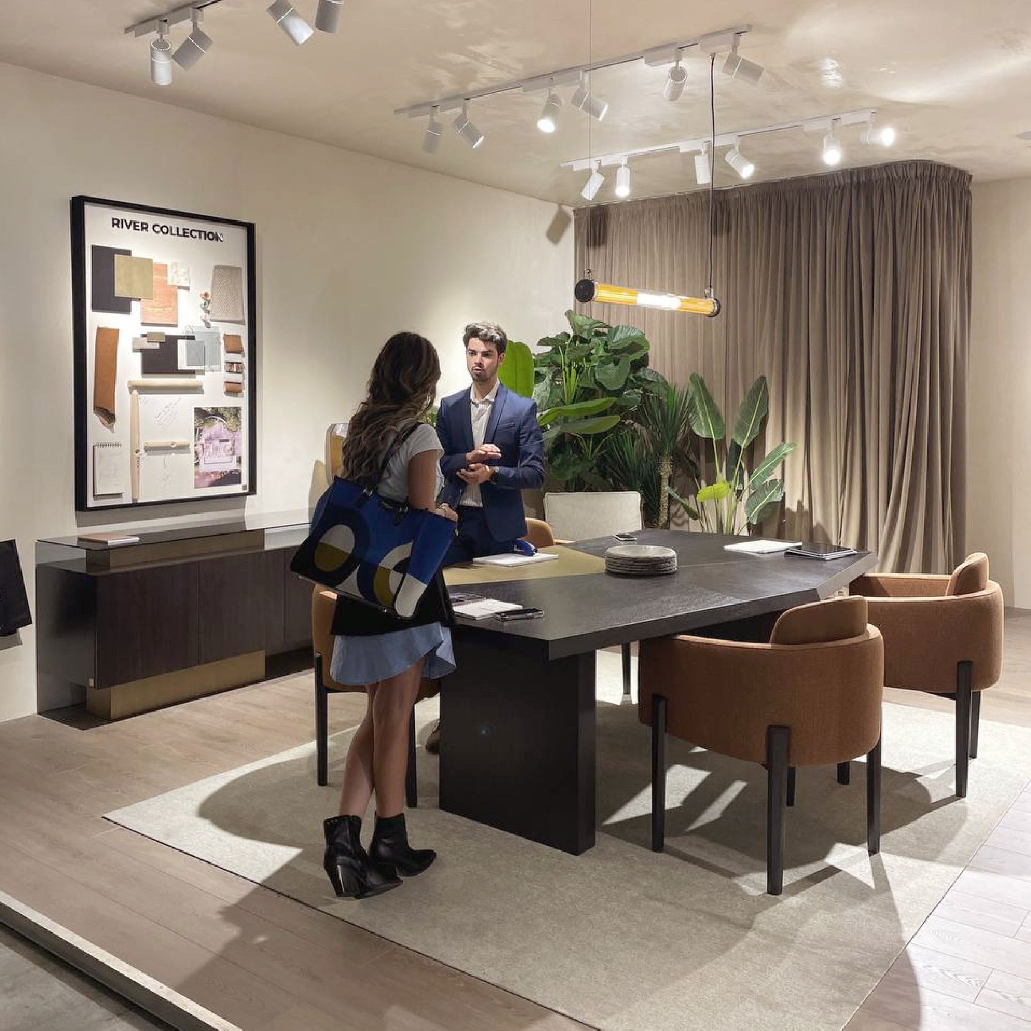 Stylish Club team networking at iSaloni 2025, engaging with designers and industry professionals amid exhibition displays.