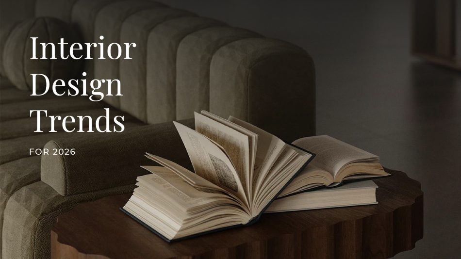 Stylish interior with a textured green sofa and scalloped-edge wooden coffee table displaying open books, evoking a cozy, intellectual ambiance. Overlay text reads 'Interior Design Trends for 2026,' suggesting a focus on upcoming home decor inspirations.