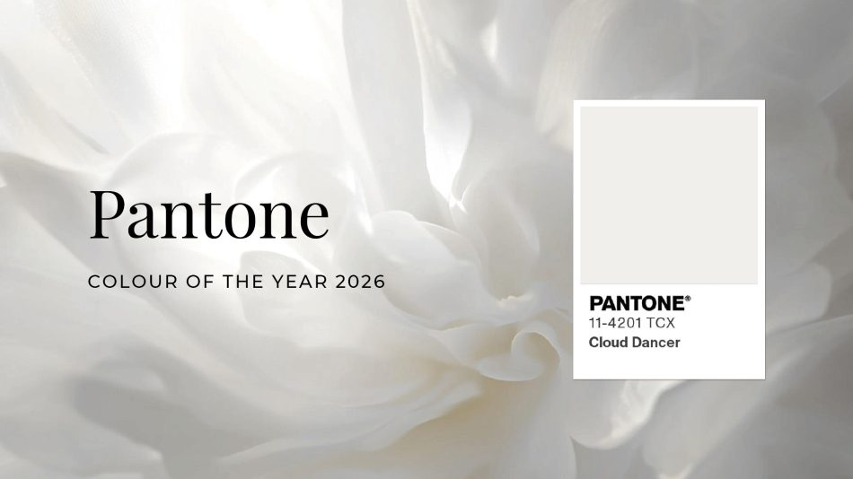 A Pantone colour swatch displaying Cloud Dance, set against a soft, ethereal white floral backdrop. The composition announces Pantone’s Colour of the Year 2026, highlighting the luminous, airy quality of this near-white hue. The delicate floral texture reinforces Cloud Dancer’s role as a blank canvas - inviting creativity, balance, and quiet sophistication across design disciplines.